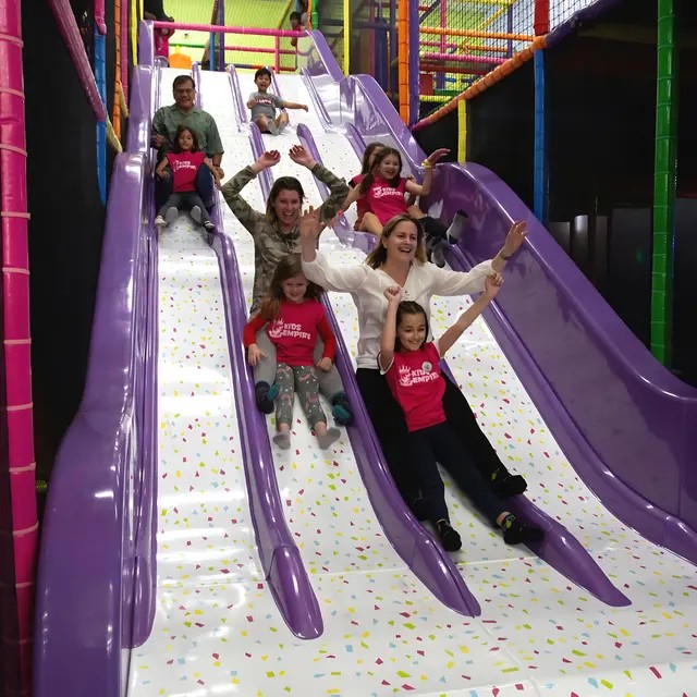 A classic: climb up the play structure, zoom back down. Again and again!